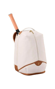 White tennis backpack with brown accents and a racket inside on a white background
