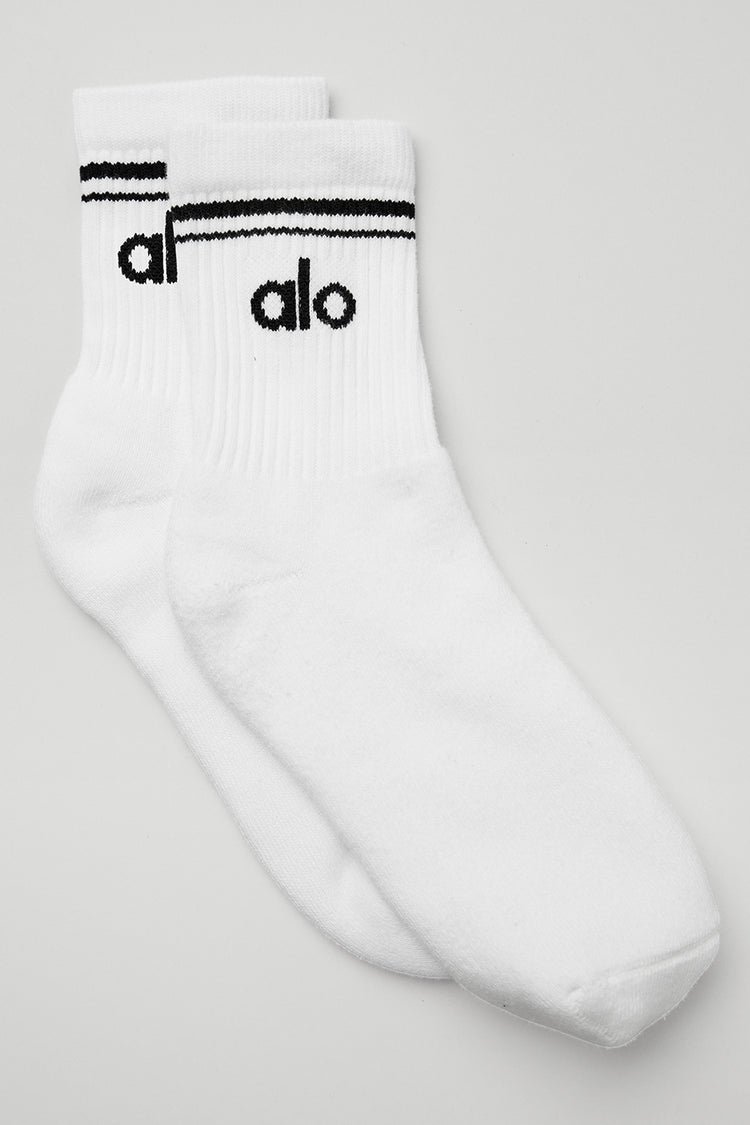 Alo Yoga Unisex Half-Crew Throwback Sock in black on a white background