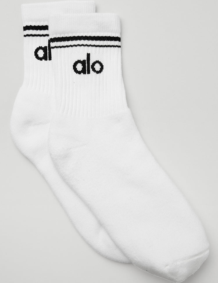 Alo Yoga Unisex Half-Crew Throwback Sock in black on a white background
