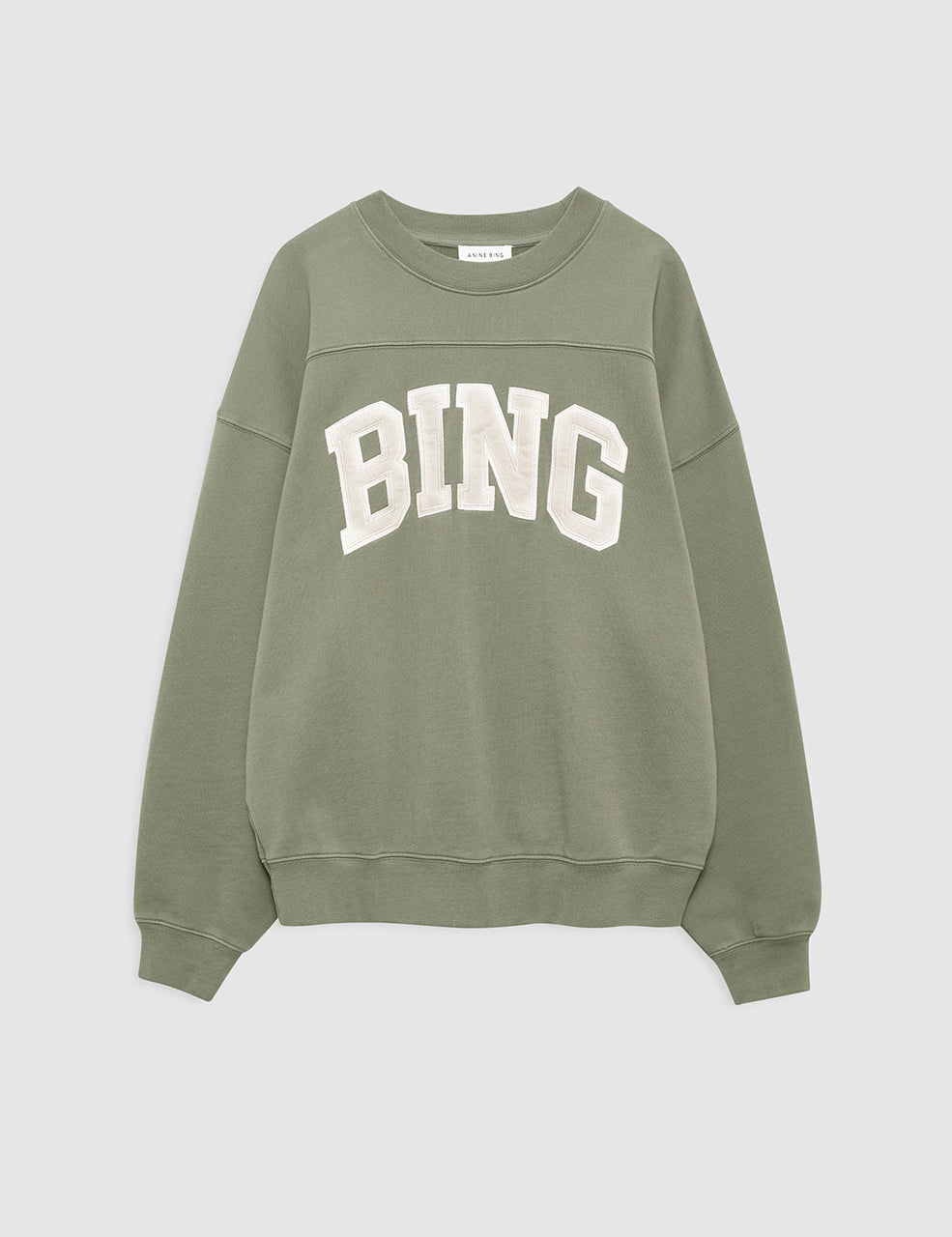 Model wearing Anine Bing Trenton Sweatshirt in washed olive