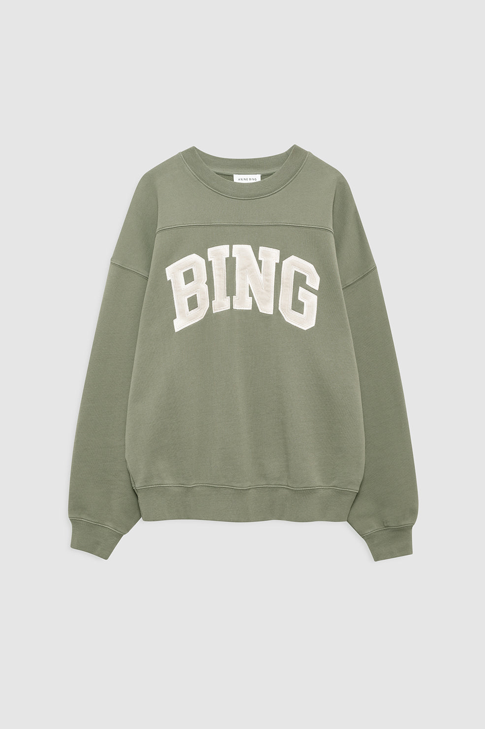 Model wearing Anine Bing Trenton Sweatshirt in washed olive
