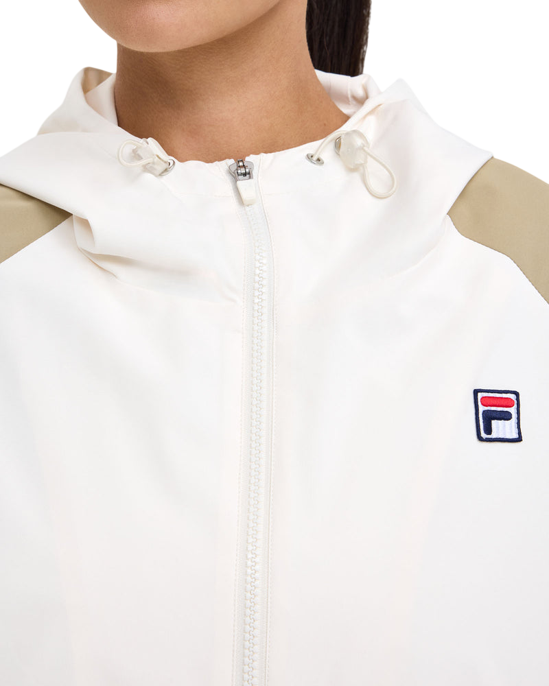 Model wearing FILA Iris Windbreaker in cream