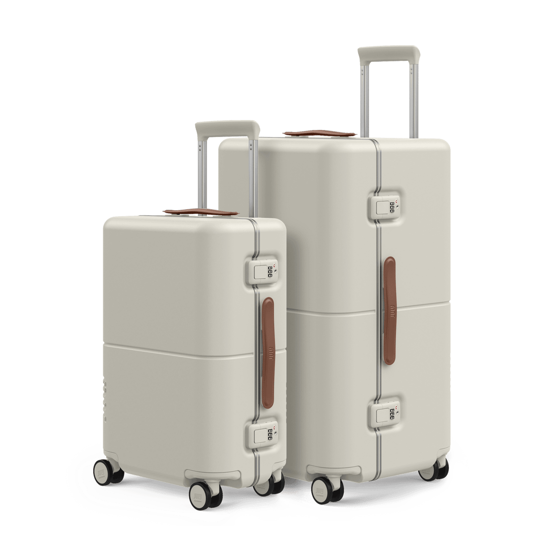 Cream large hard-shell checked trunk and carry-on trunk set, front view on white background