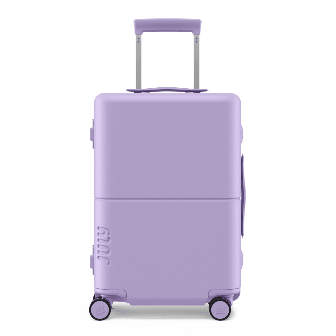 Lilac hard-shell carry-on trunk, front view on white background