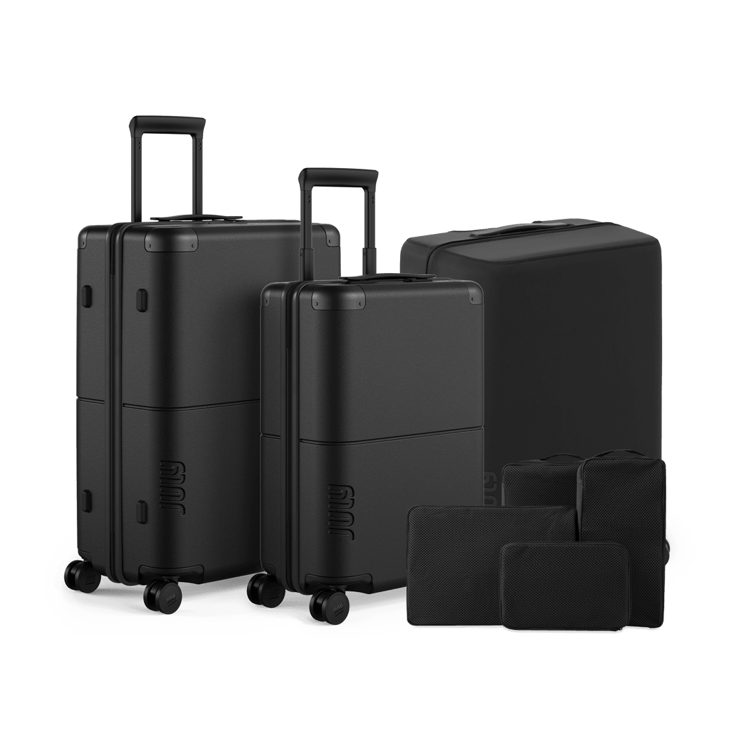 Classic travel luggage set in matching colourway, front view on white background