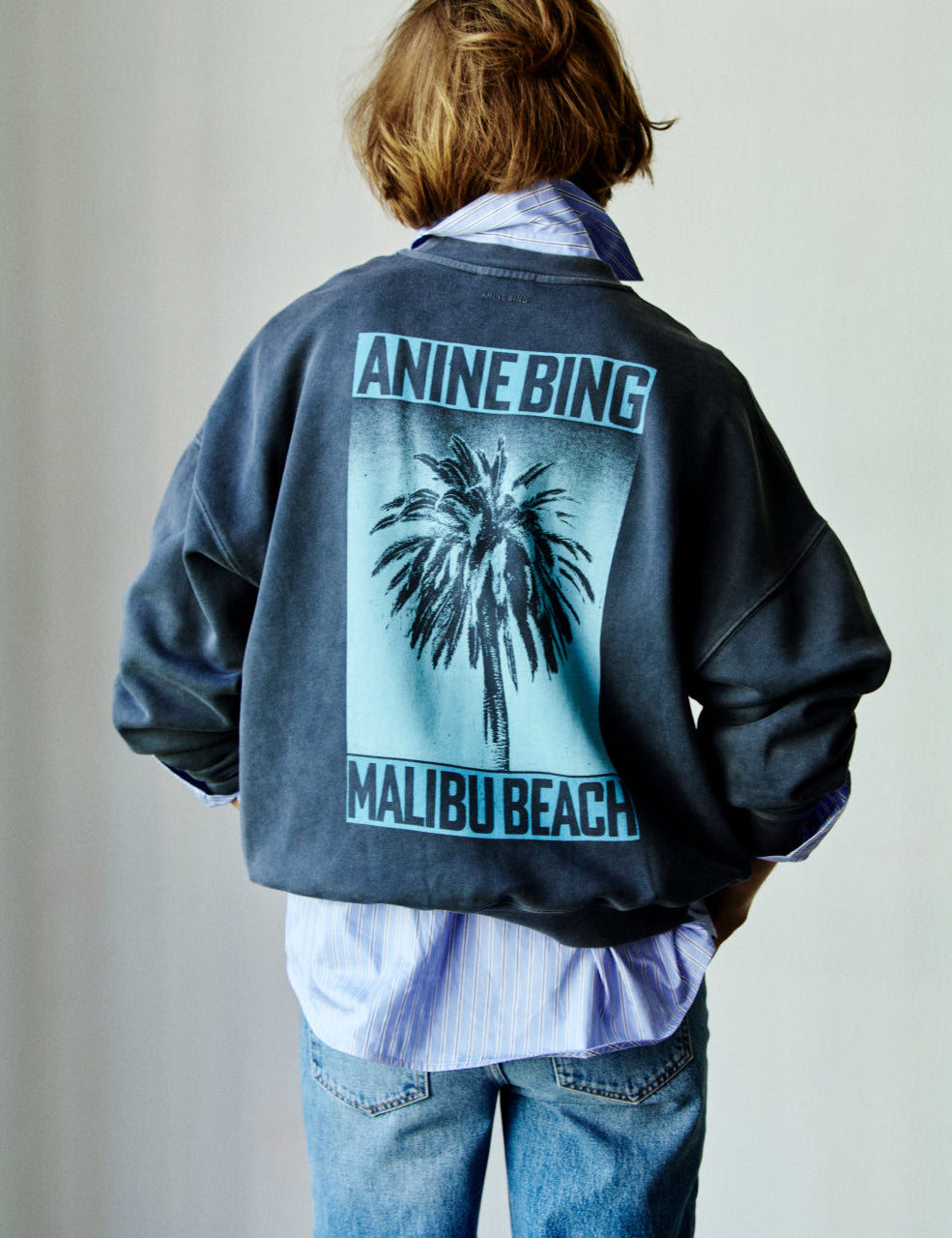 Model wearing Anine Bing Miles Sweatshirt in palm