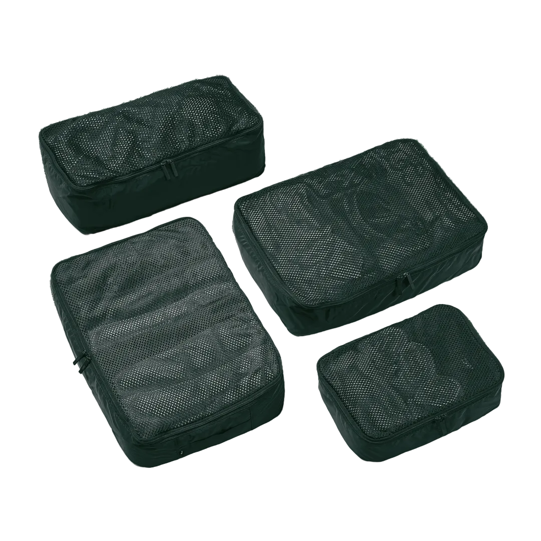 Four black mesh packing cubes on a white background