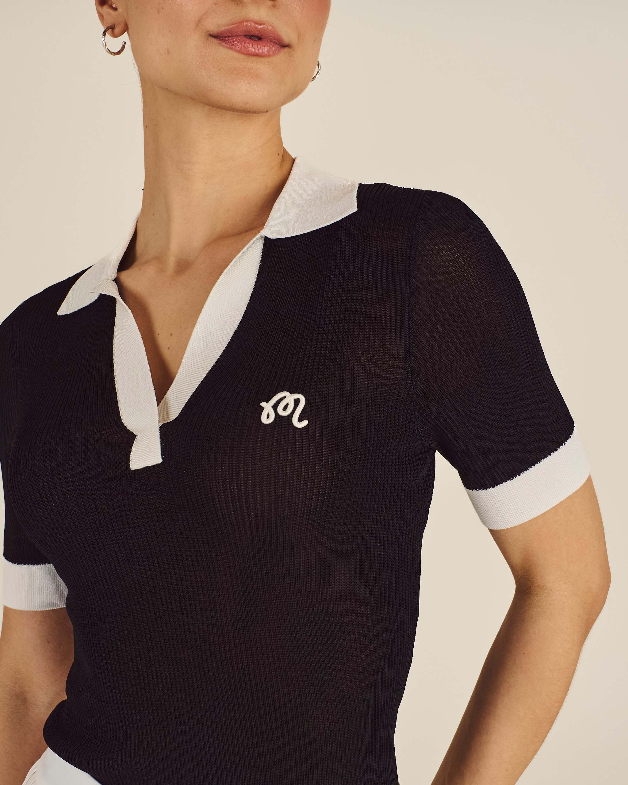 Model wearing Malbon Melany Polo in black navy