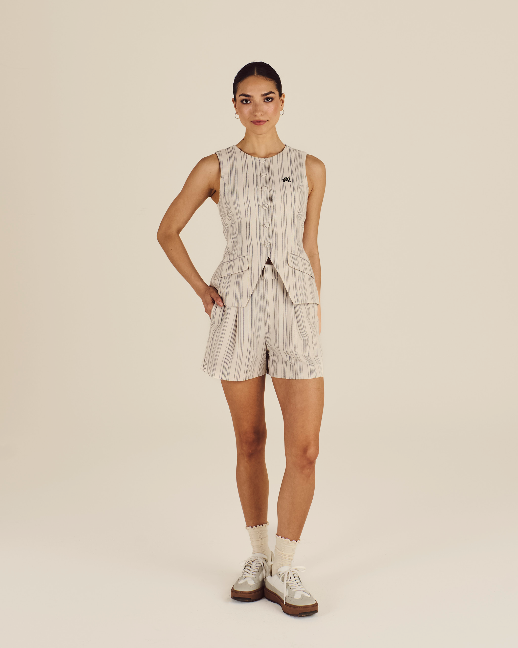 Model wearing Malbon Keily Short in cream sage