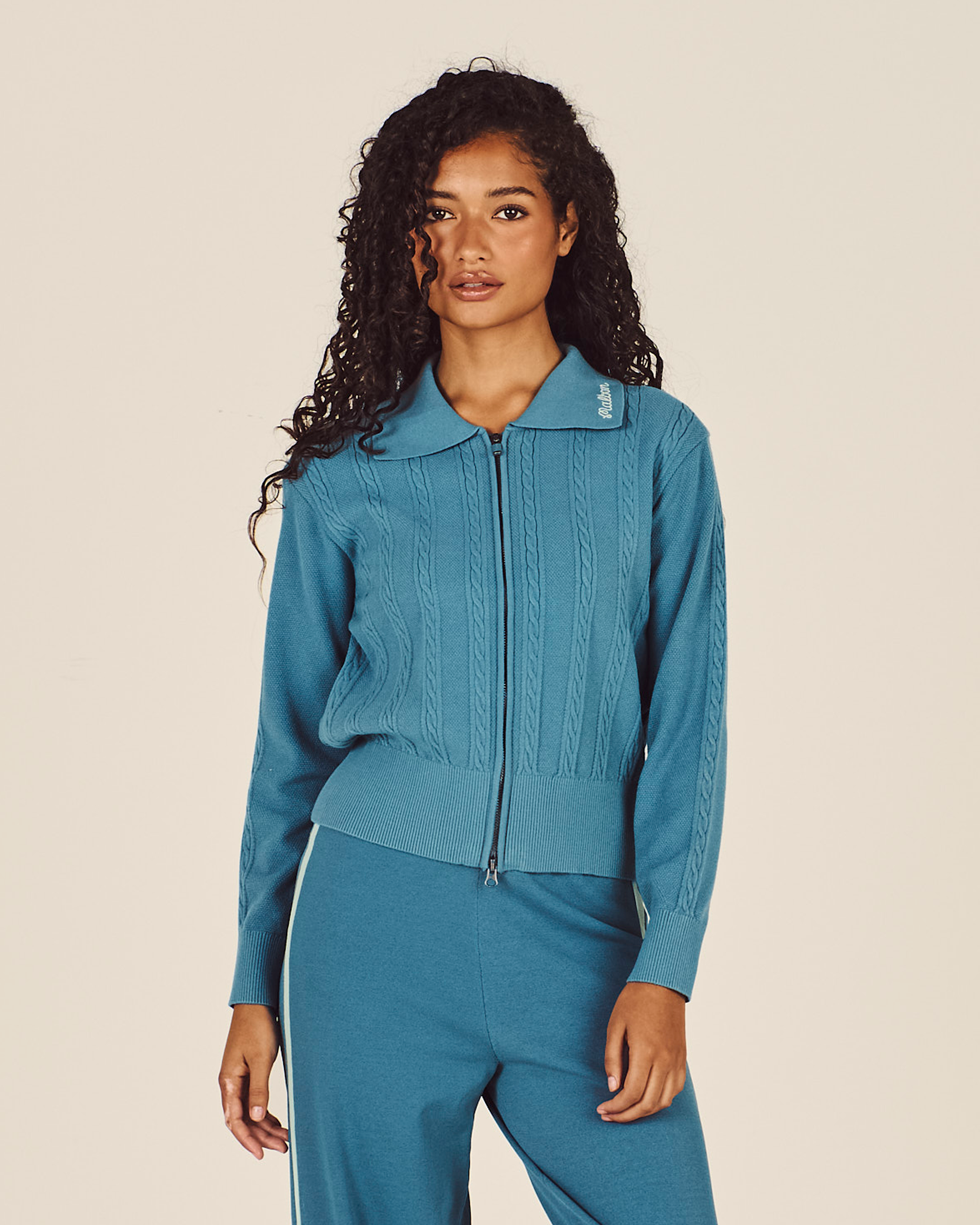 Model wearing Malbon Bianca Sweater in agave