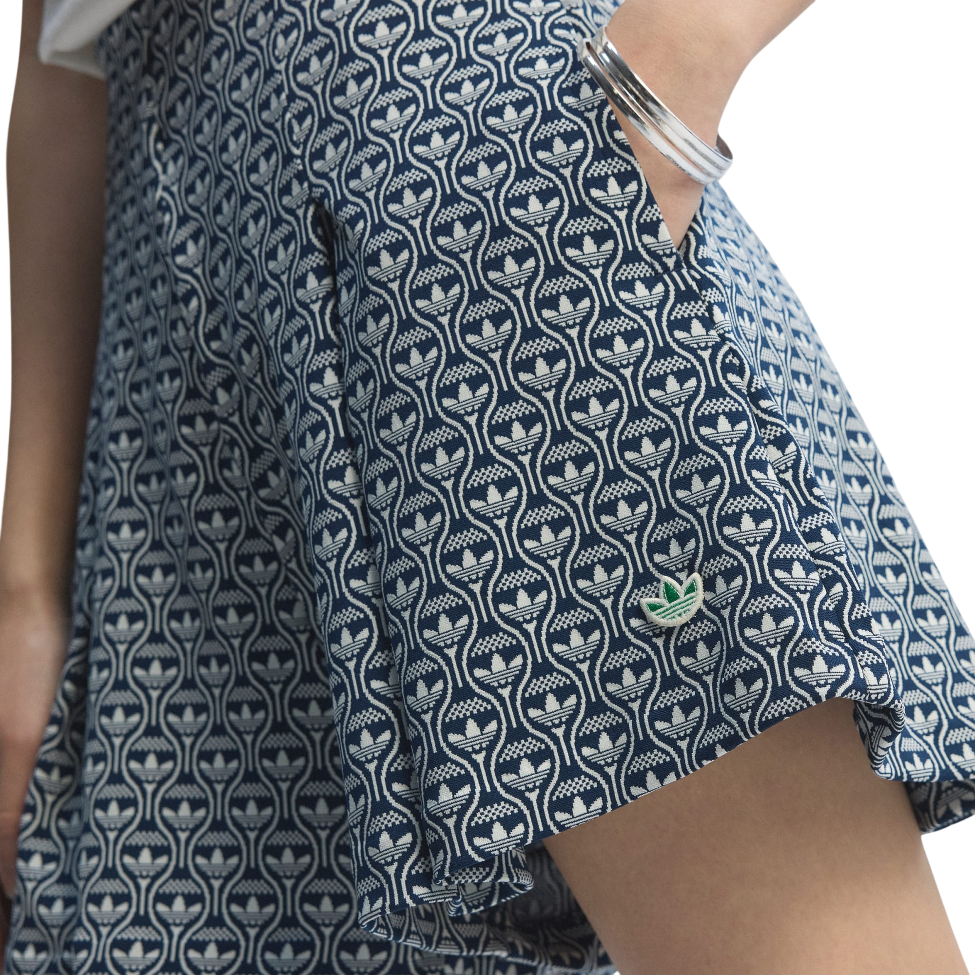 Model wearing adidas Originals All Over Skort in blue