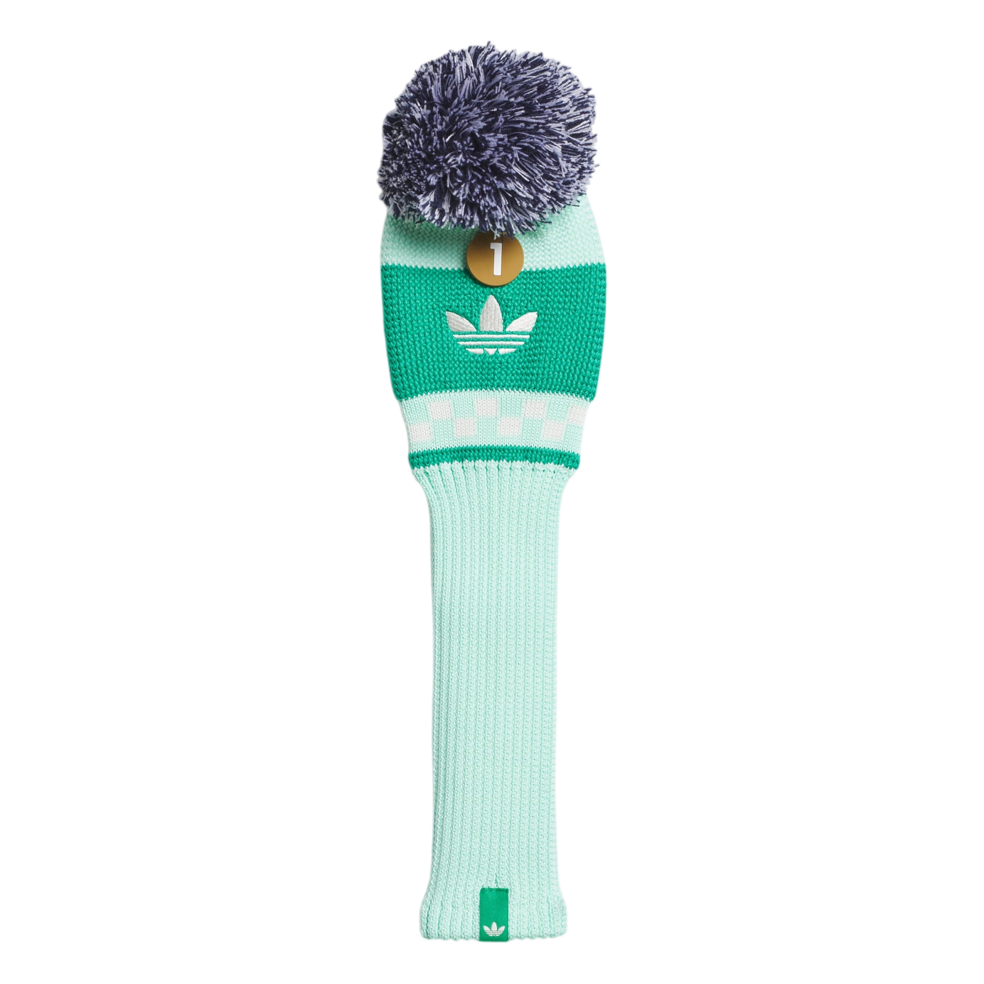Green golf club head cover with a pom-pom on a light gray background