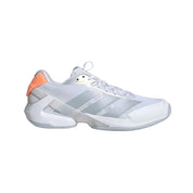 White athletic shoe with orange accents on a light gray background