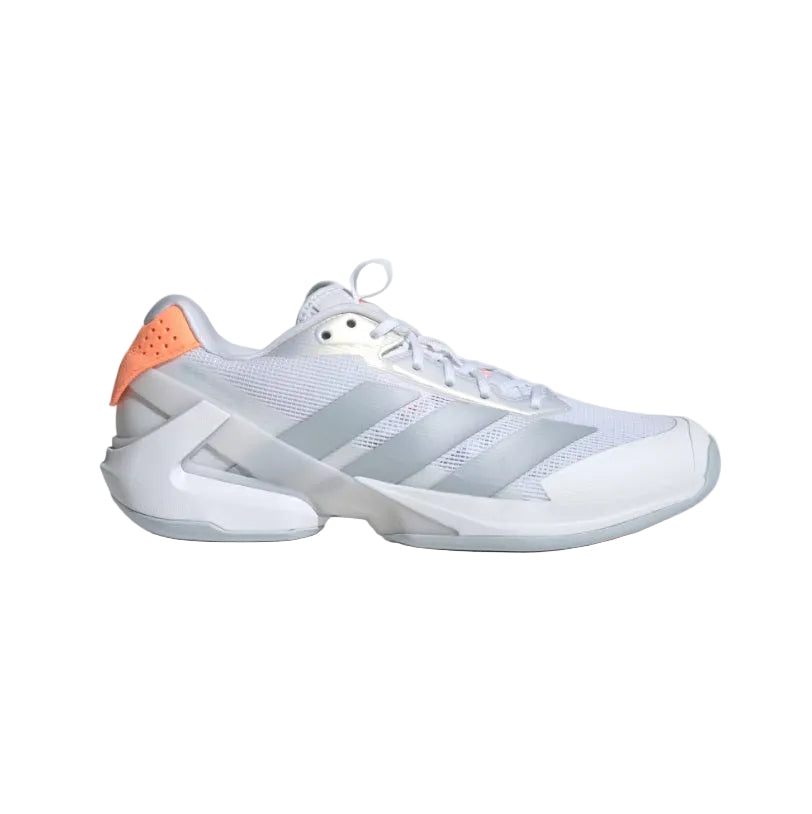 White athletic shoe with orange accents on a light gray background