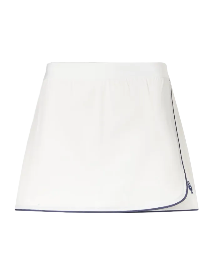 White skirt with blue trim on a light gray background