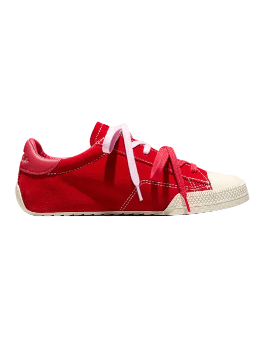 Red sneaker with white sole on a light gray background