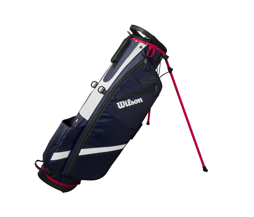 A Wilson golf stand bag in navy blue, white, and red, shown standing open on its red support legs against a plain white background.