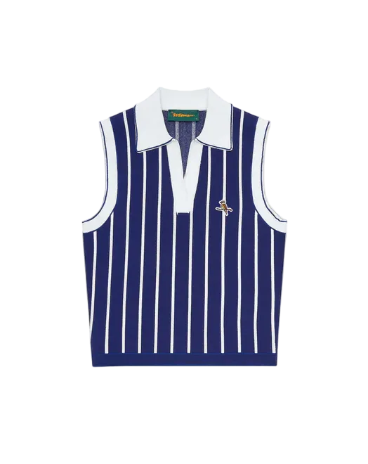 A sleeveless knit polo vest with vertical navy and white stripes, featuring a white collar and a small embroidered polo player logo on the left chest, set against a solid off-white background.