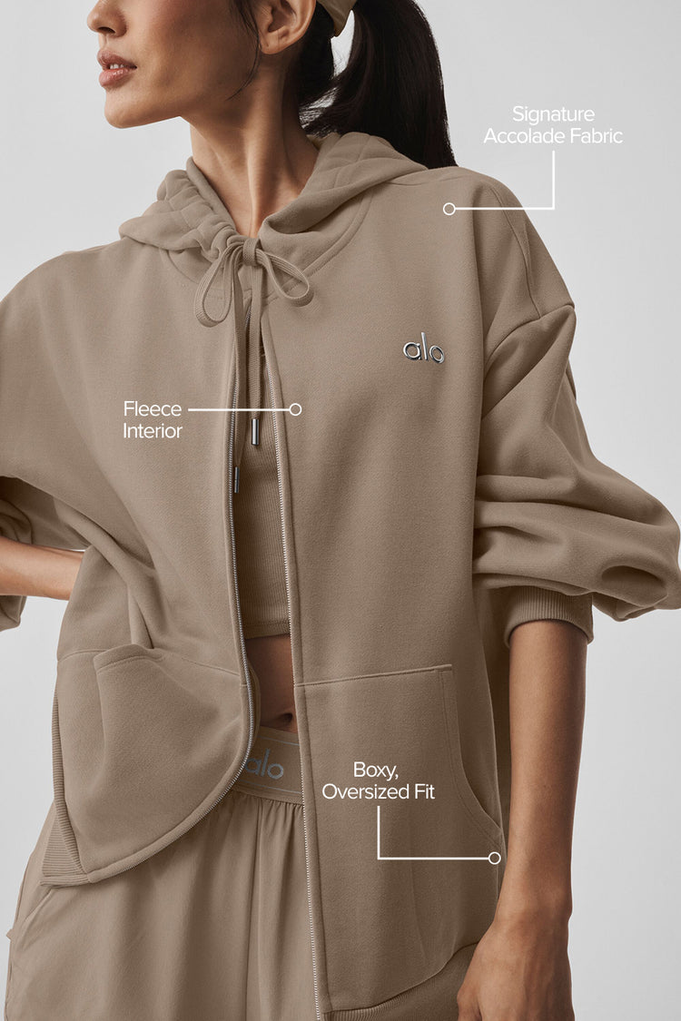 Model wearing Alo Yoga Accolade Full Zip Hoodie in cacao