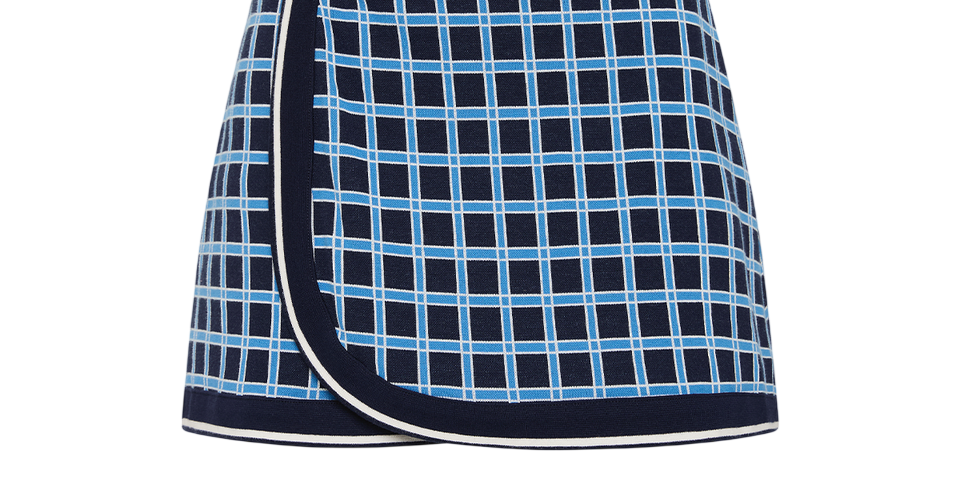 Navy blue skirt with a light blue checkered pattern on a white background