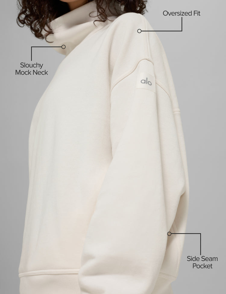 Model wearing Alo Yoga Hazy Mock Neck Pullover in ivory