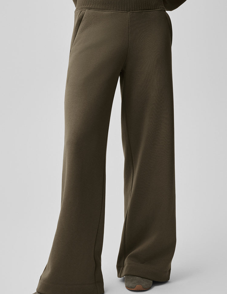 Model wearing Alo Yoga Serenity Wide Leg Sweatpant in lavender