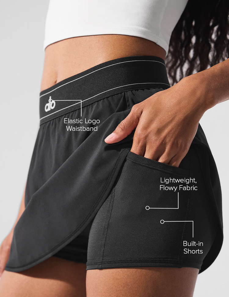 Model wearing Alo Yoga Match Point Tennis Skirt