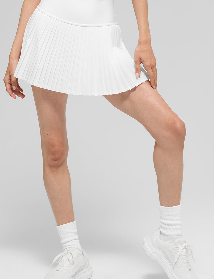 Model wearing Alo Yoga Grand Slam Tennis Skirt