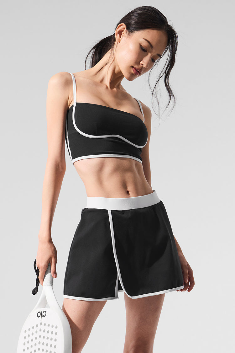 Model wearing Alo Yoga Airbrush Streamlined Skirt in white
