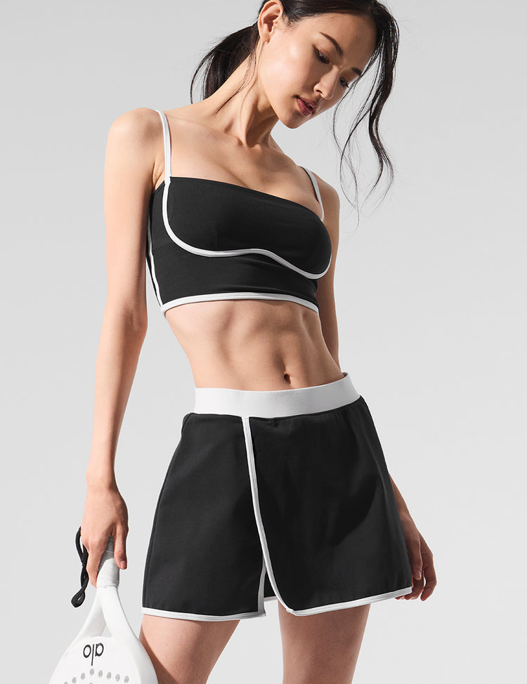 Model wearing Alo Yoga Airbrush Streamlined Skirt in white