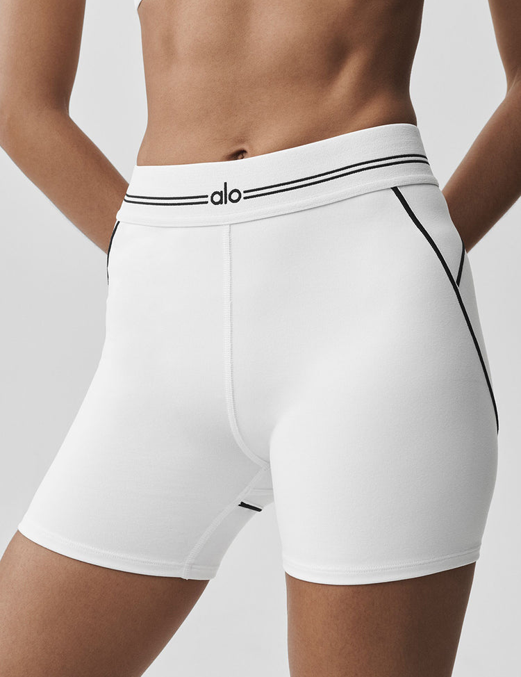 Model wearing Alo Yoga 4" Airbrush High-Waist Heart Throb Short in lavender