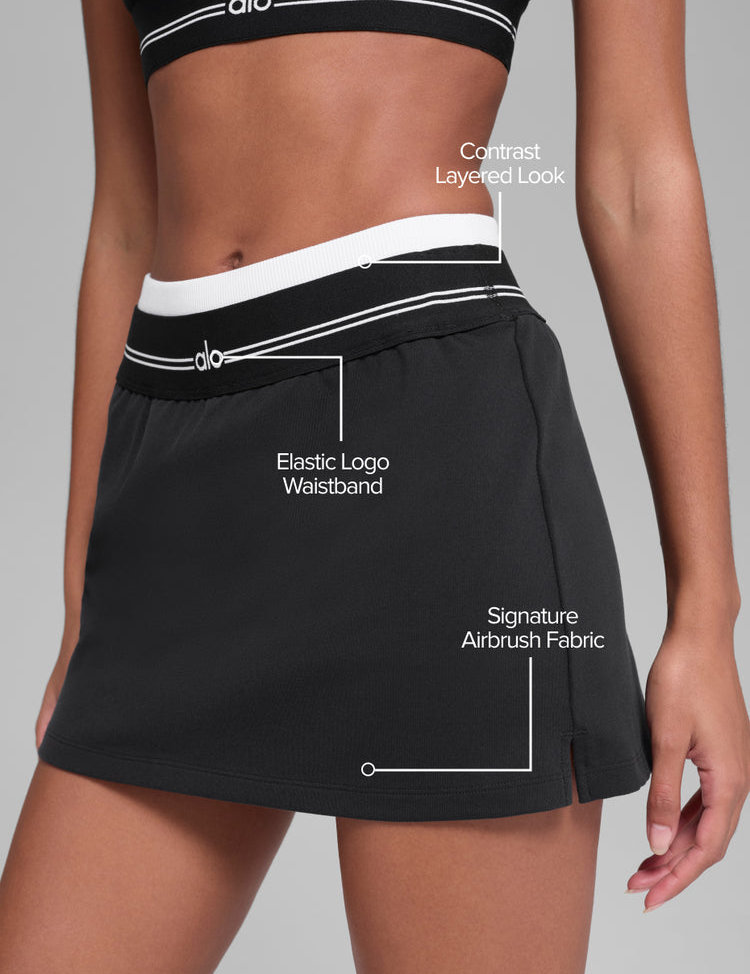 Model wearing Alo Yoga Airbrush Better Together Tennis Skirt in slate