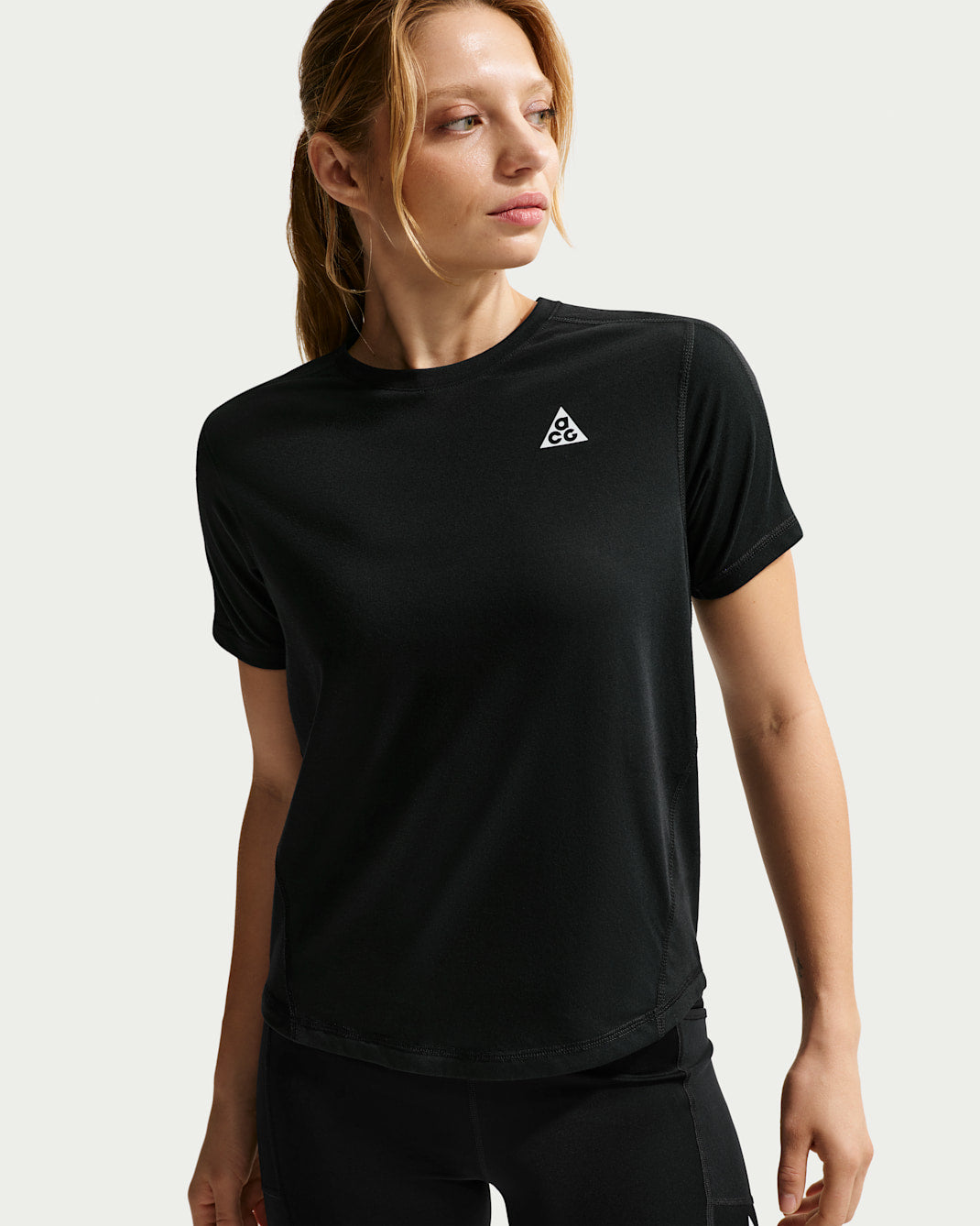 Green short-sleeve Dri-FIT performance top, front view on white background