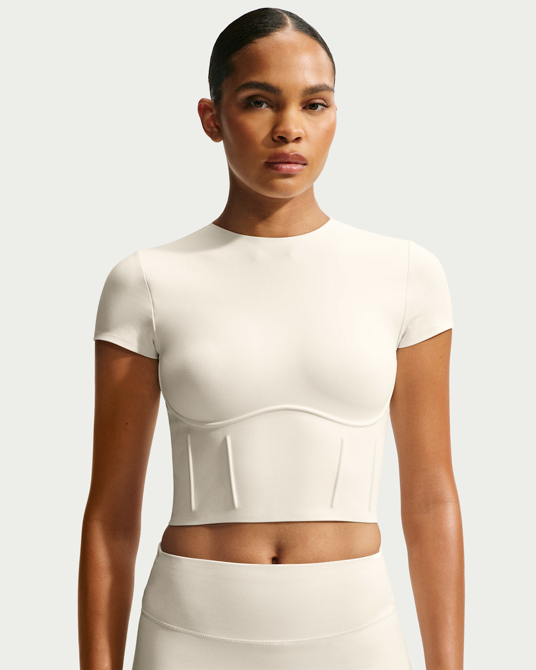 Black matte corset cropped top, front view on white background