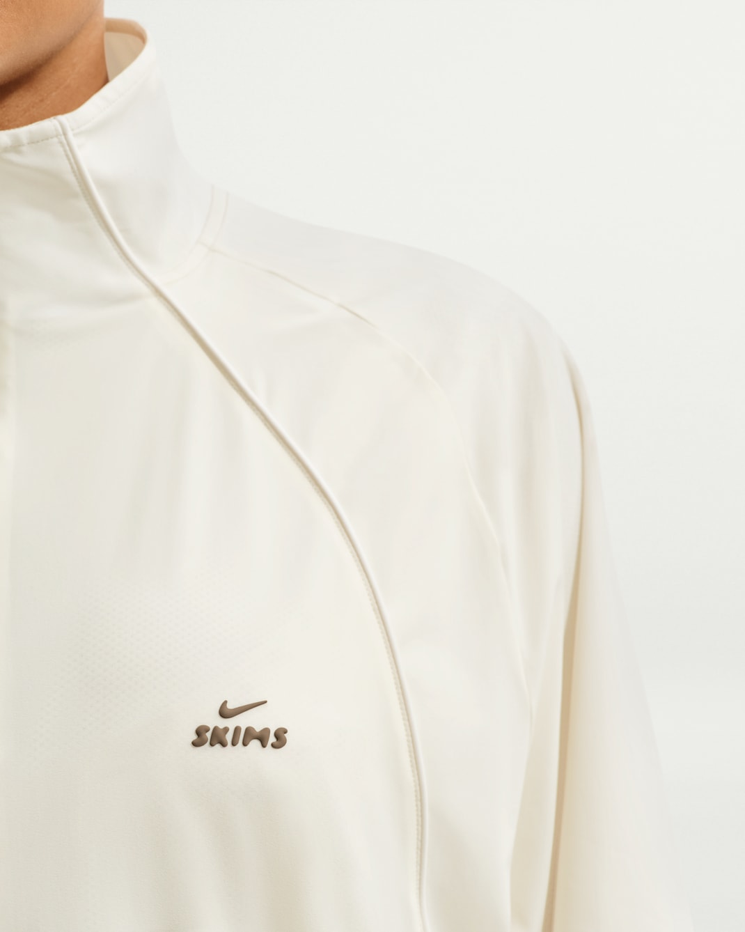 Black stretch nylon oversized jacket, front view on white background
