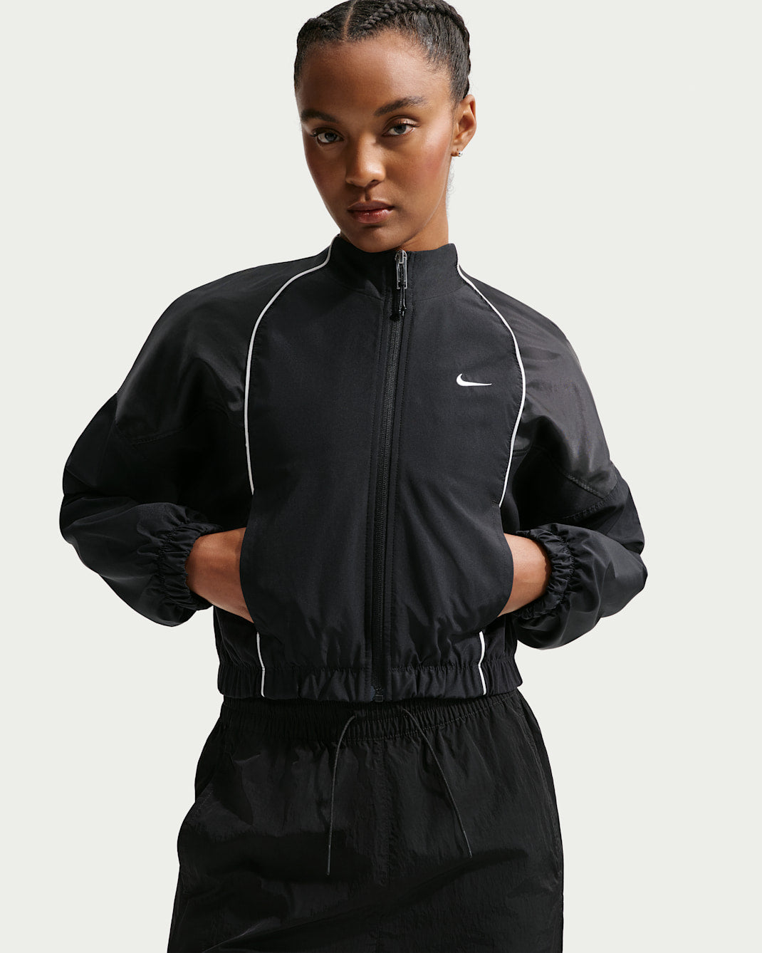 White shrunken tracksuit jacket with zip front, front view on white background