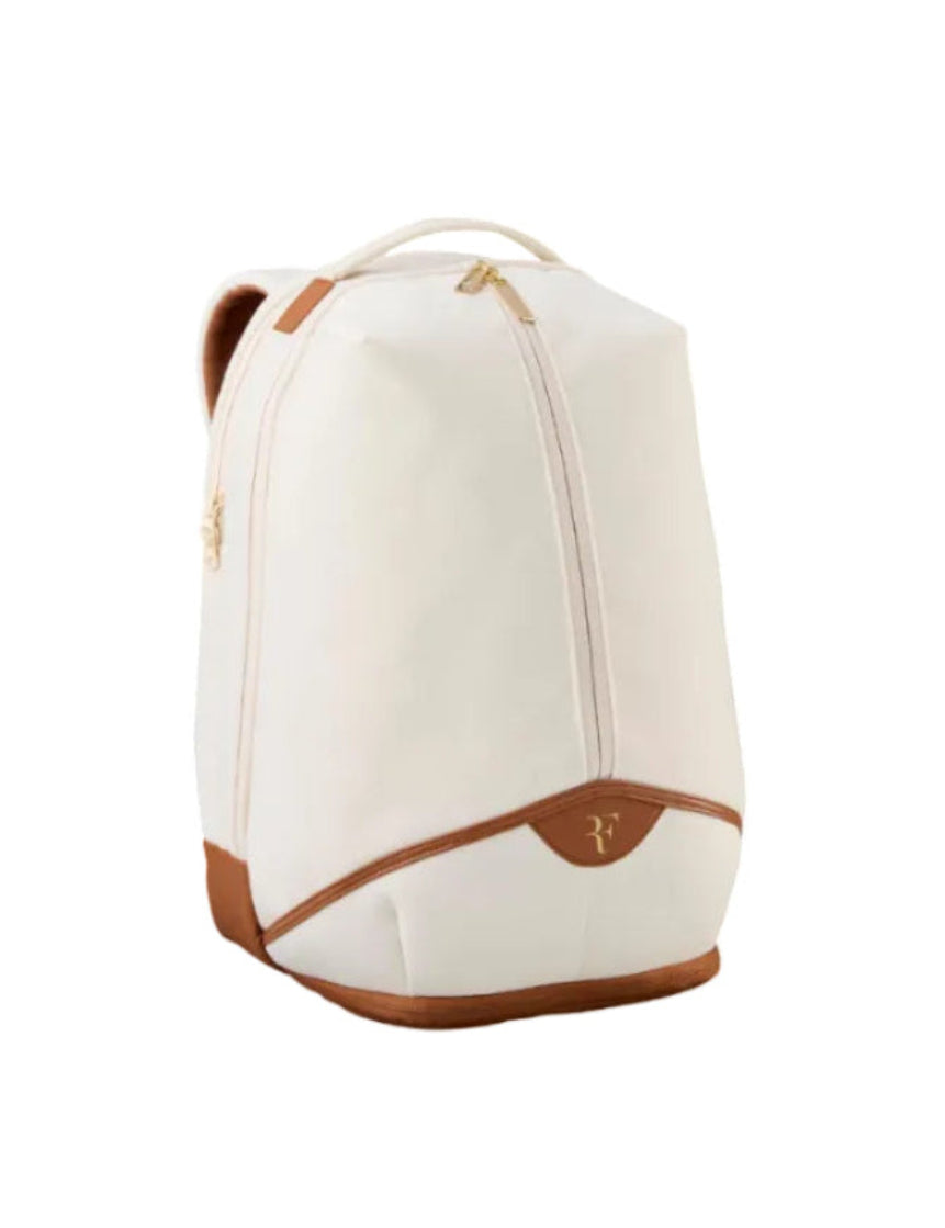 White backpack with brown accents on a white background