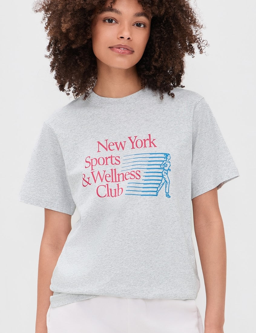 Model wearing Sporty & Rich New York Motion T-Shirt