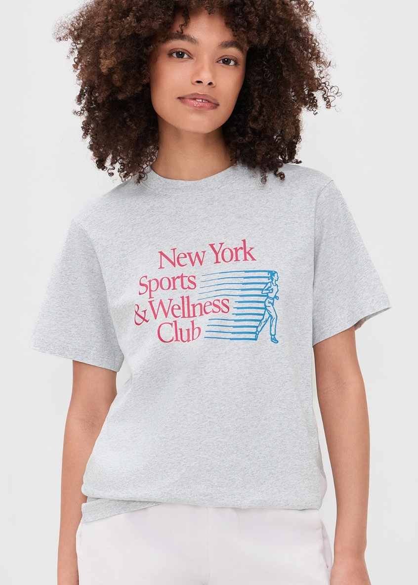 Model wearing Sporty & Rich New York Motion T-Shirt