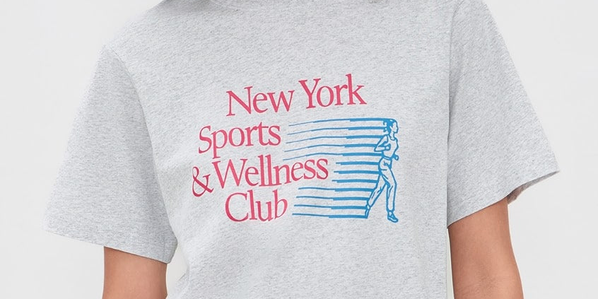 Model wearing Sporty & Rich New York Motion T-Shirt