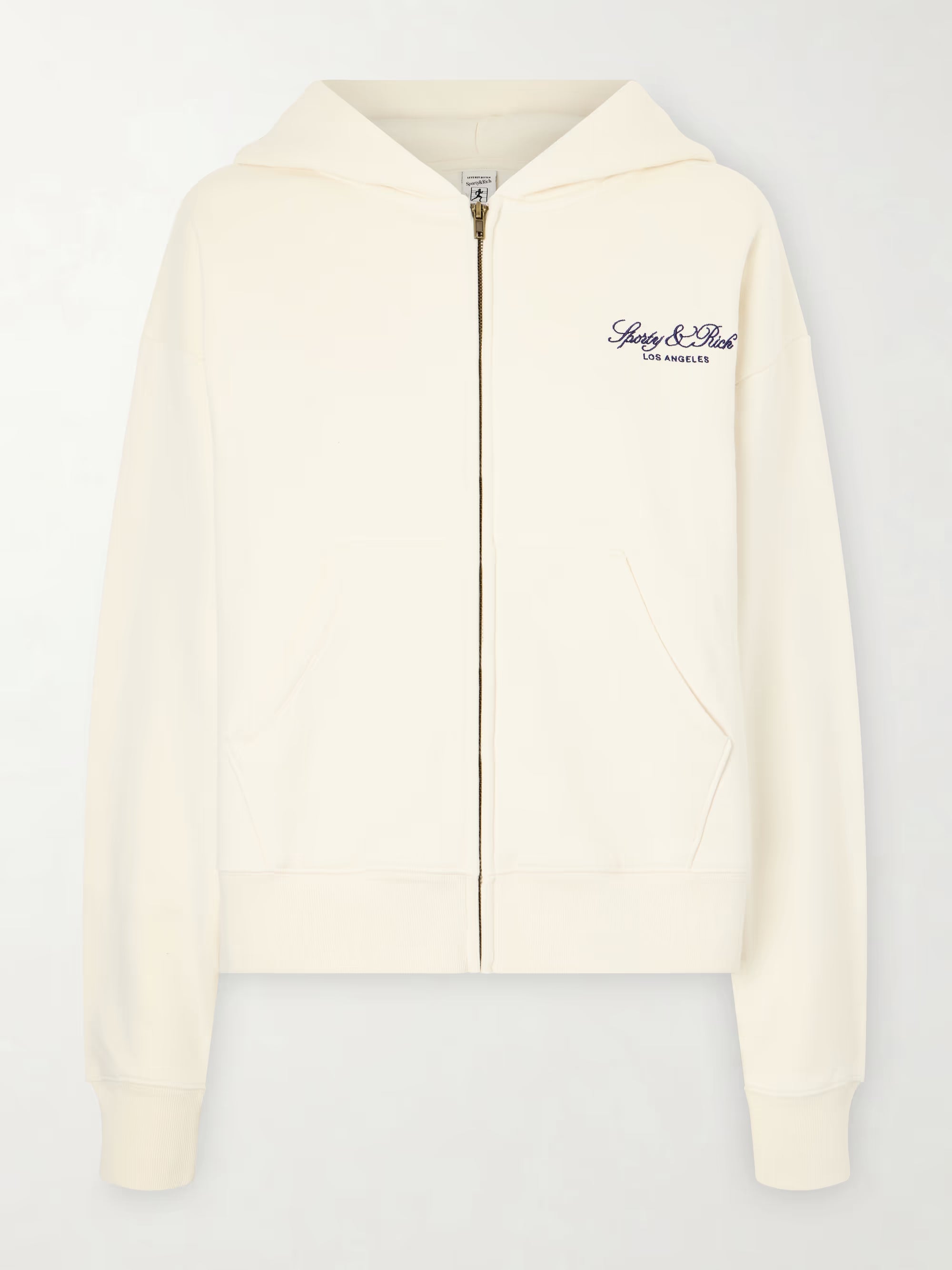 white tracksuit top with gold zipper up the front with sporty & rich logo on left chest
