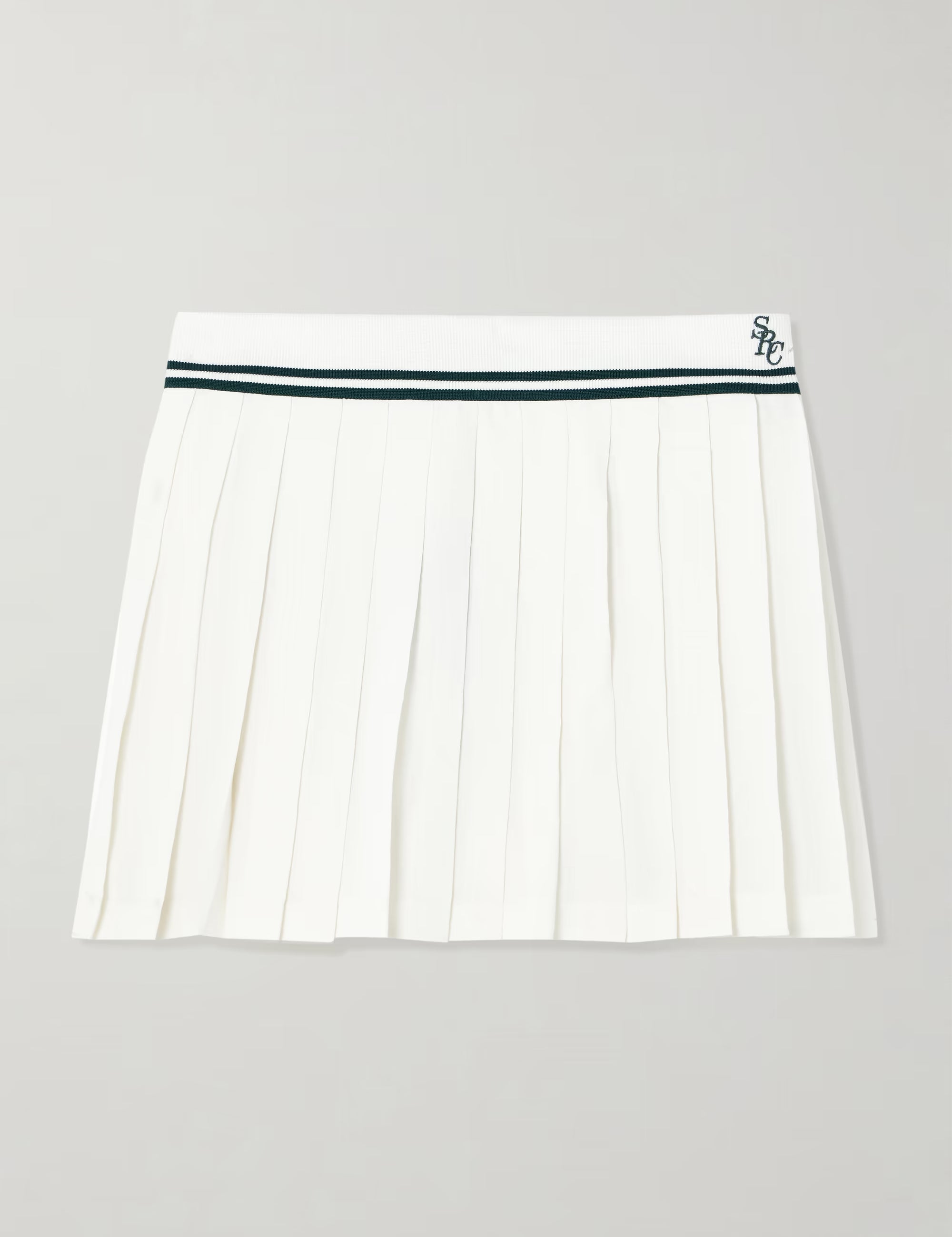 White pleated skirt with a green waistband on a light gray background