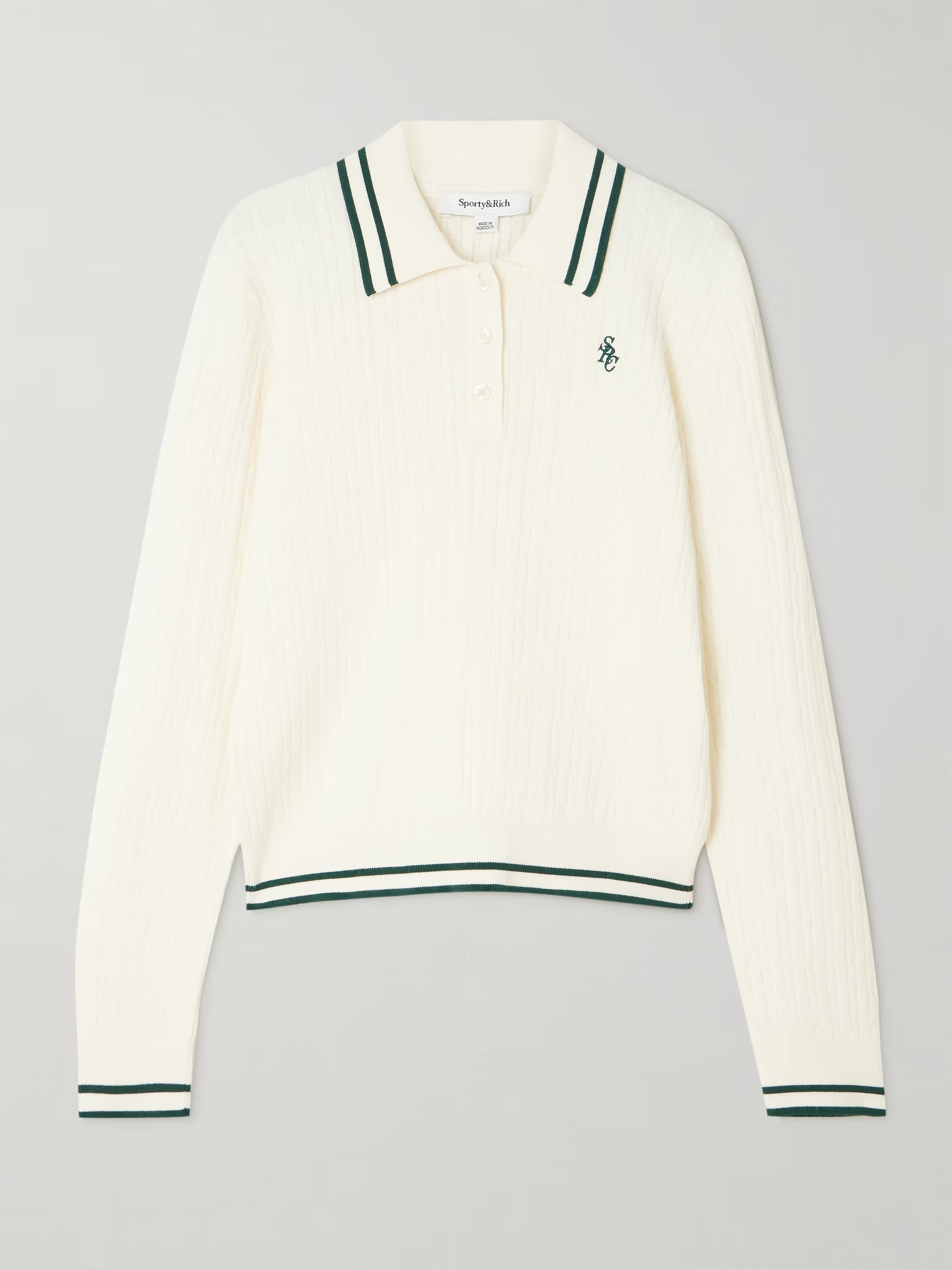White long-sleeve polo shirt with green accents on a gray background